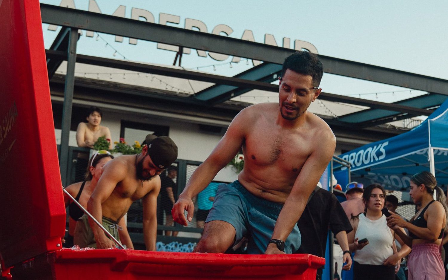 Guests using the cold plunges at a Lone Star Sauna event activation
