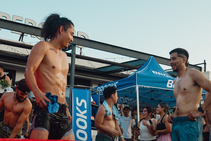 Guests cycling between the sauna and cold plunges at an outdoor event