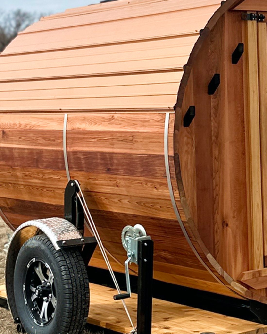 The barrel sauna mounted on its custom trailer